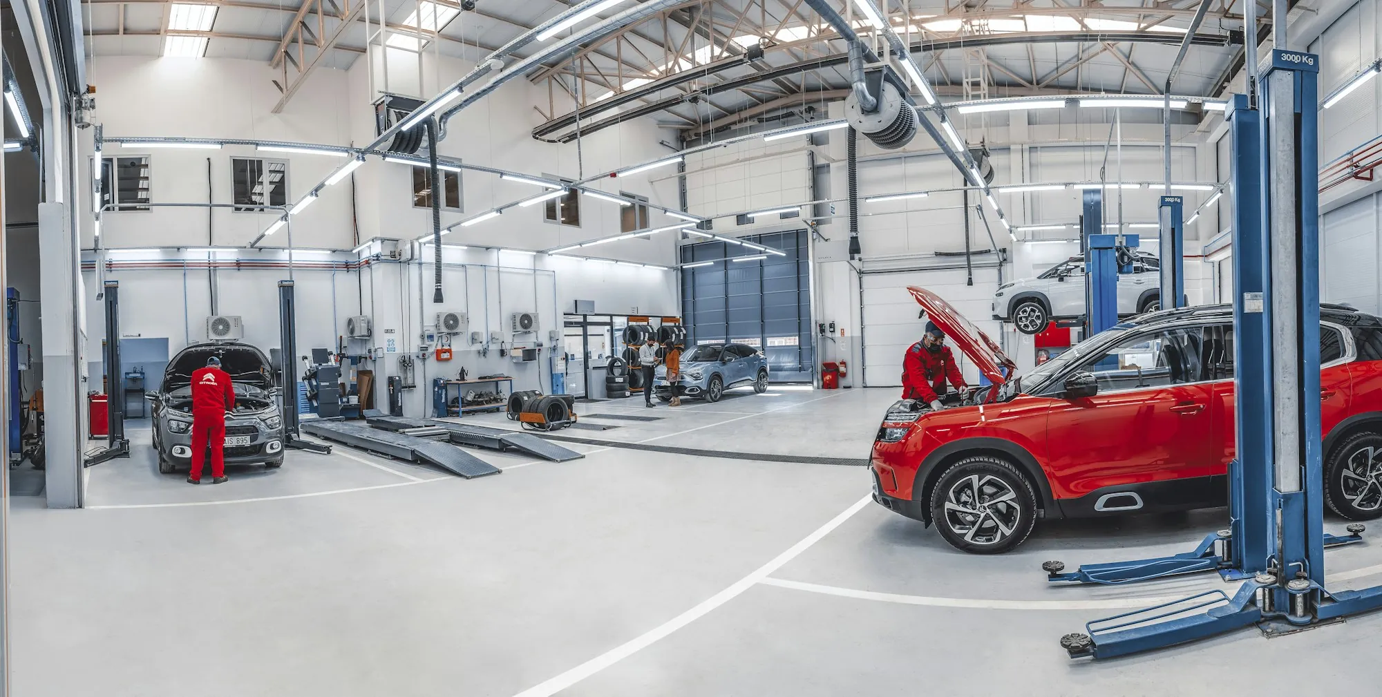 Bright, open repair shop with several vehicle lifts